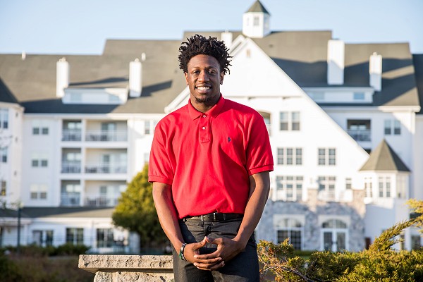 Deonte, Cooperative Education student in front of The Osthoff Resort.
