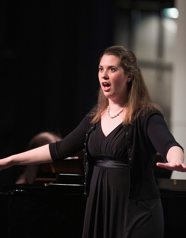 Lakeland choir student singing at concert.